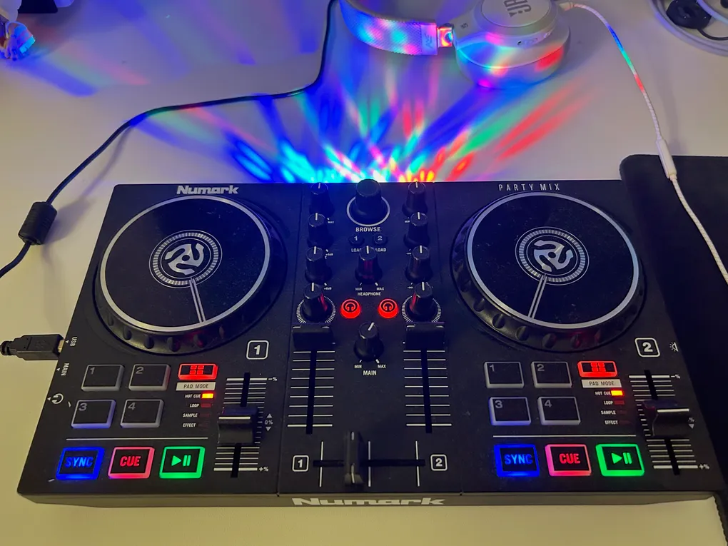 Close-up of a DJ controller with colorful pads