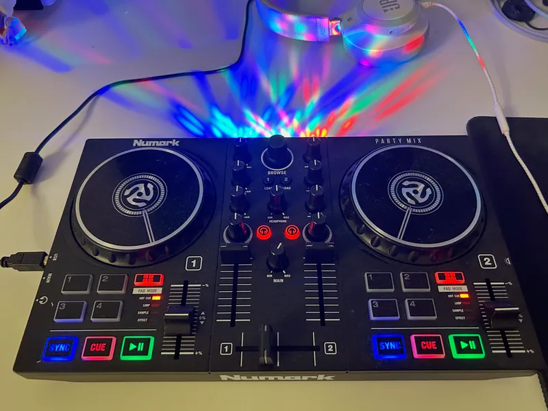 Close-up of a DJ controller with colorful pads