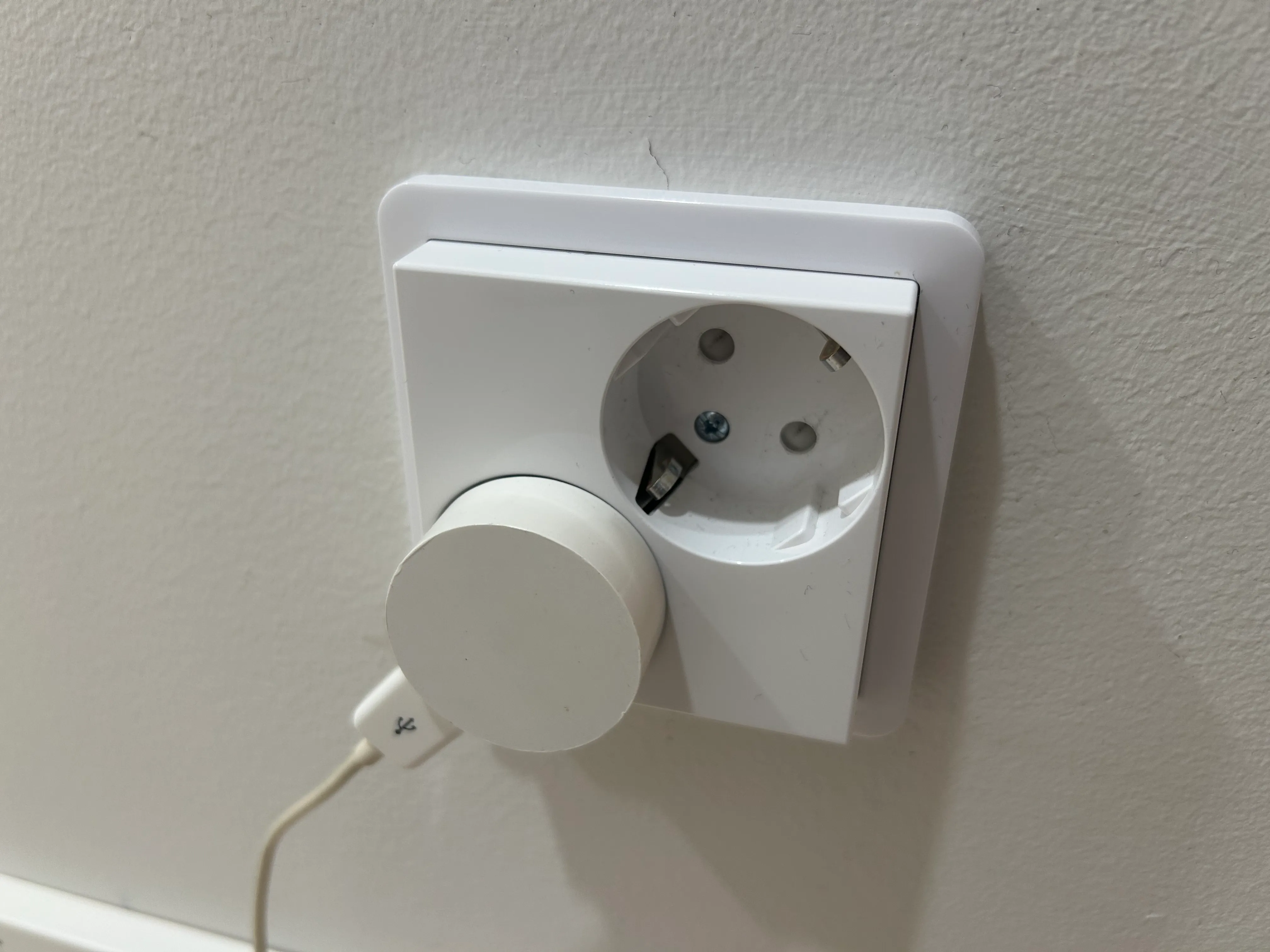 My circular charger plugged in a wall
