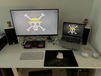 Desk with monitor, laptop, keyboard and mouse