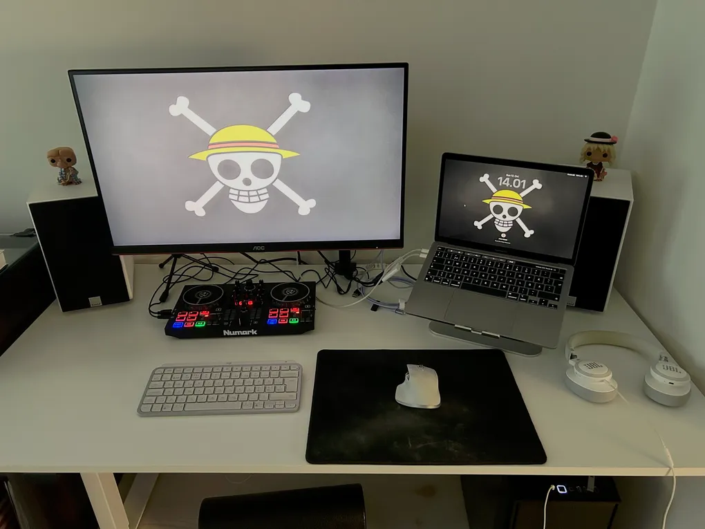 Desk with monitor, laptop, keyboard and mouse